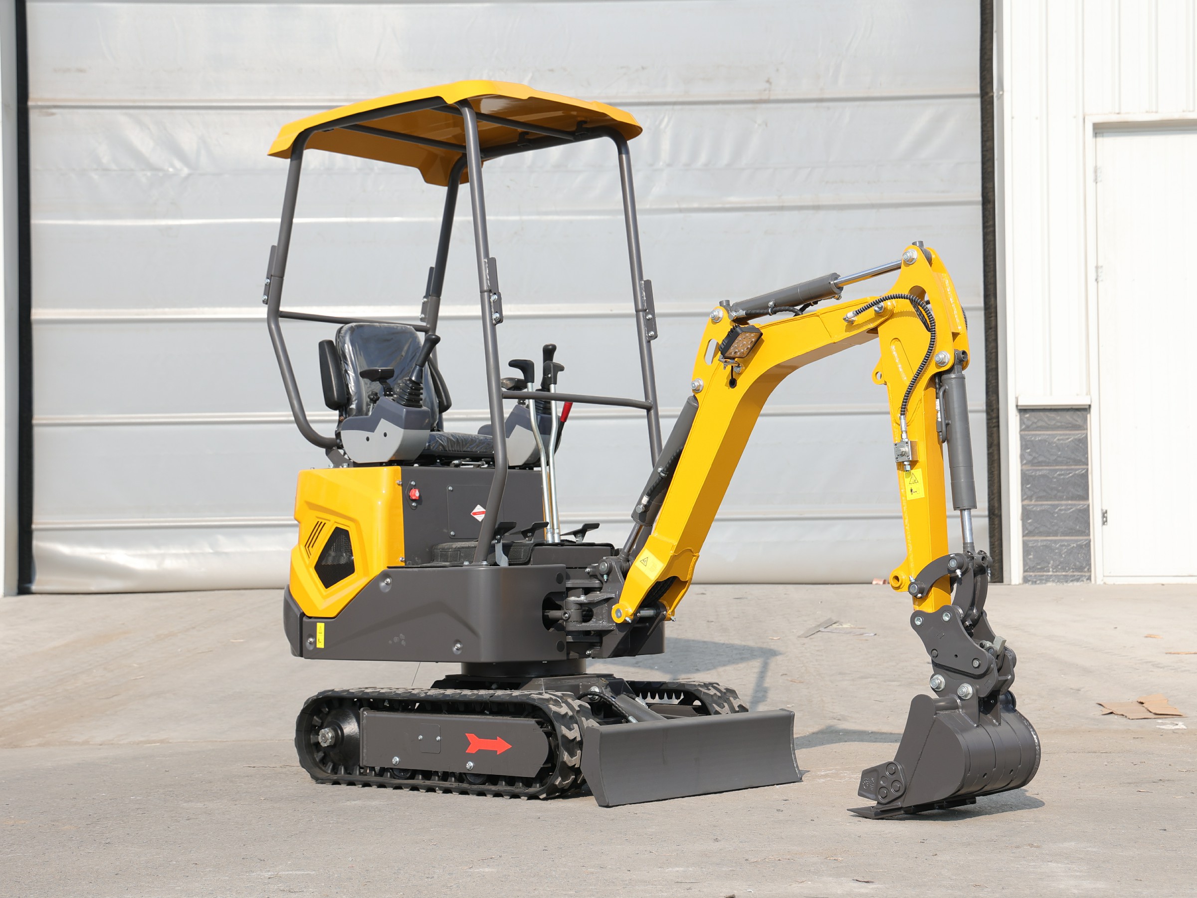 Huayee HY12 mini excavator, front-quarter view with bucket raised