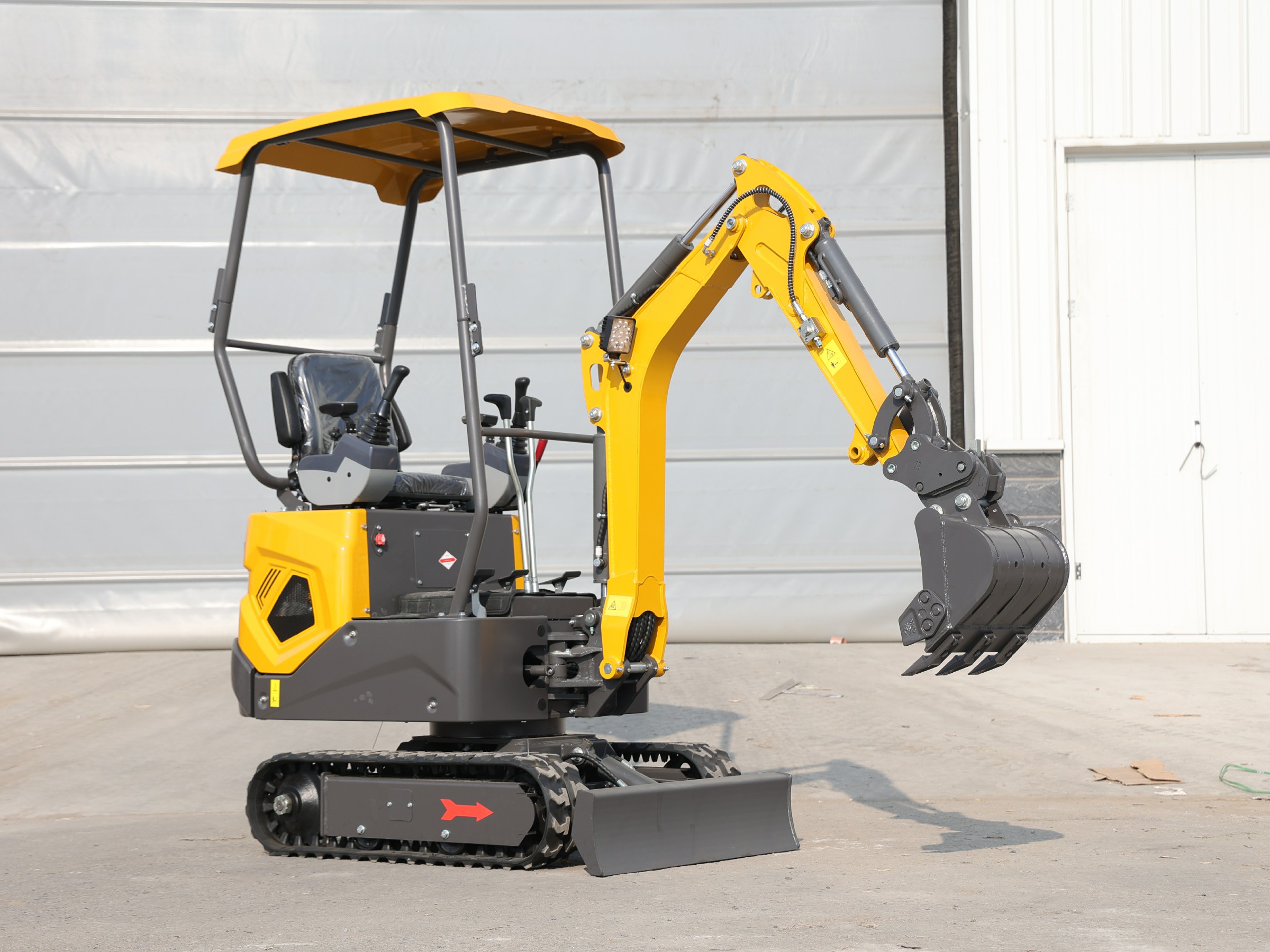 Huayee HY12 mini excavator, front view with arm raised