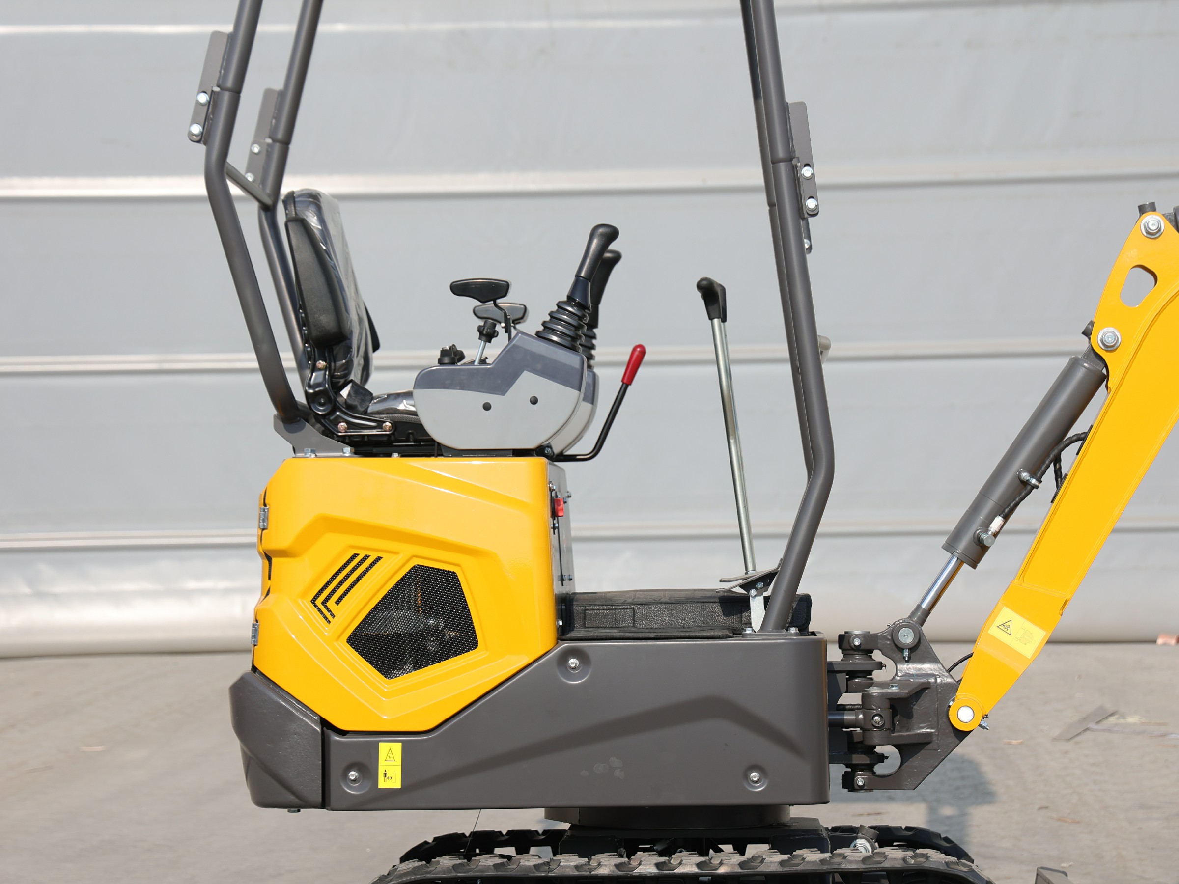 Huayee HY12 mini excavator, rear-quarter view of engine cover and seat