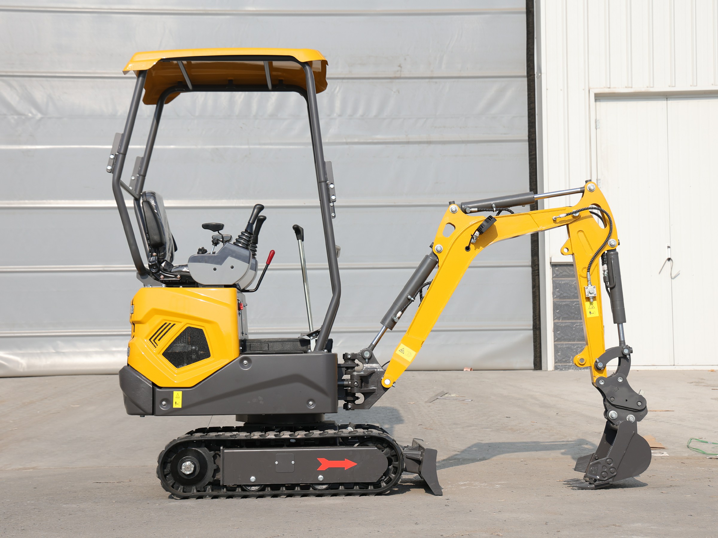Huayee HY12 mini excavator, full side view with bucket lowered