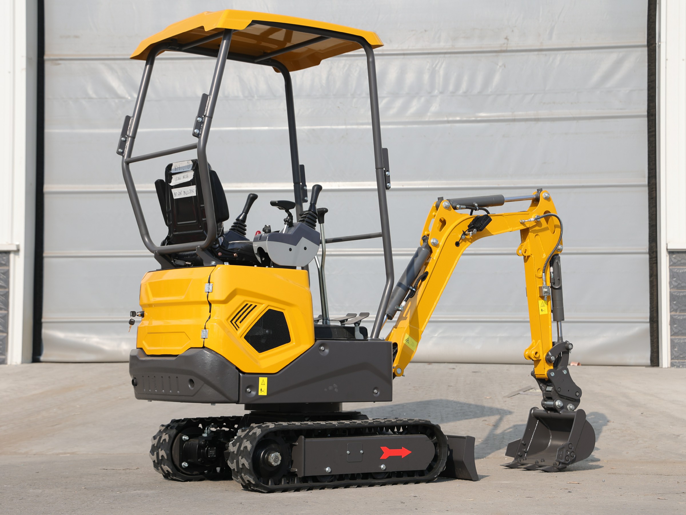 Huayee HY12 mini excavator, front-quarter view with bucket lowered